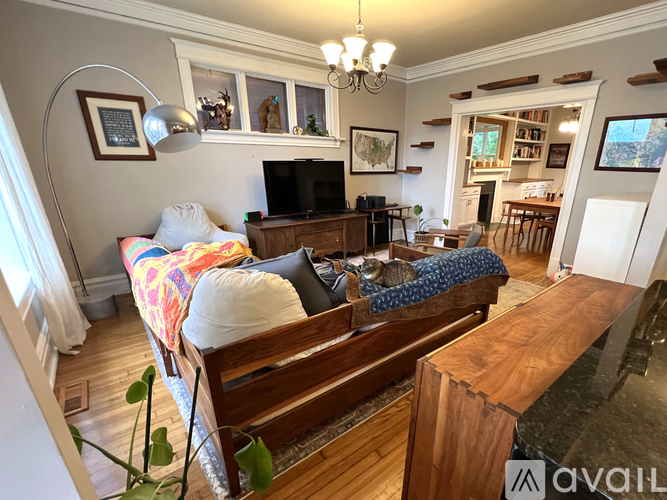 A living room with a couch and a television.
