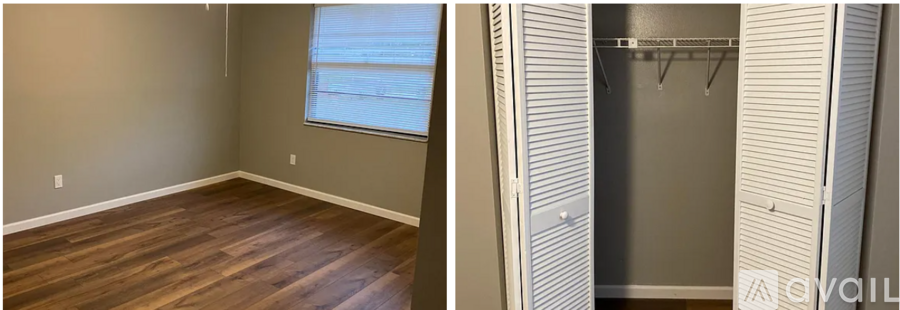 A room with a wooden floor and a closet with a shelf.