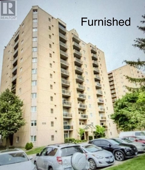 A tall apartment building with the word "Furnished" written above it.
