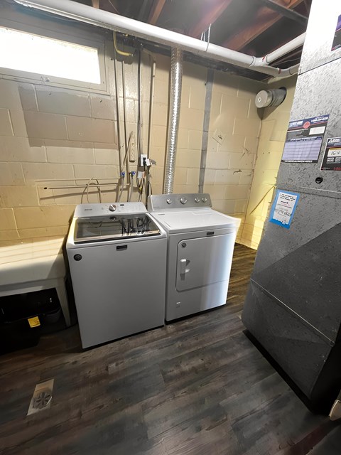 A kitchen with a dishwasher and a washing machine.