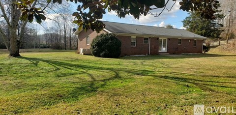 A house with a lawn in front of it is for sale.