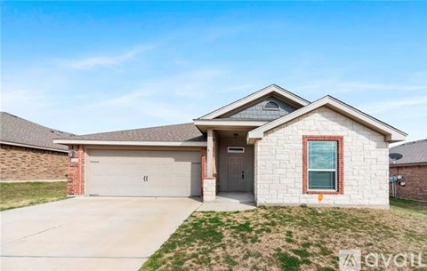 A two-story house with a garage is for sale.