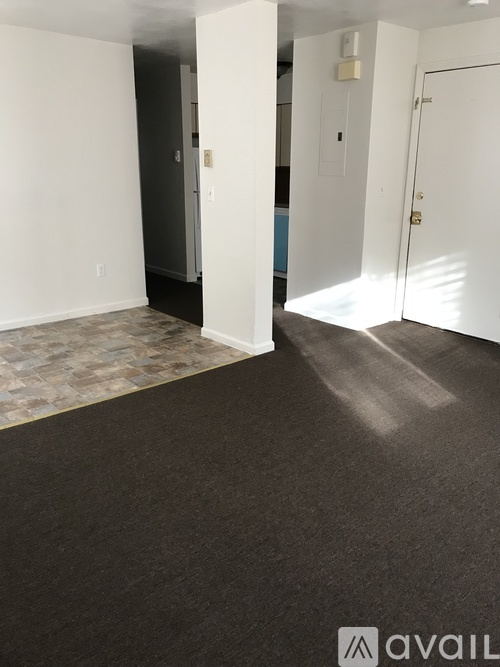 A room with a tiled floor and white walls.