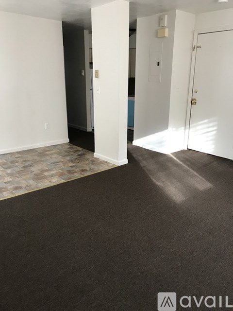 A room with a tiled floor and white walls.