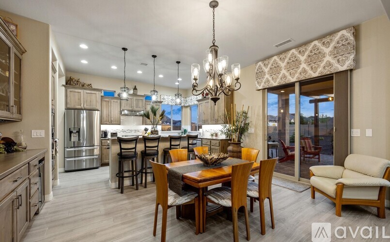 A modern kitchen with a dining table set for six.