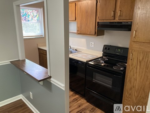 A kitchen with a stove and cabinets.