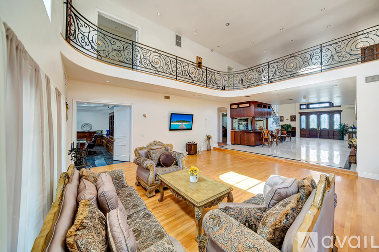 A living room with a large sofa and a coffee table.
