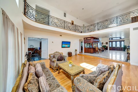 A living room with a large sofa and a coffee table.