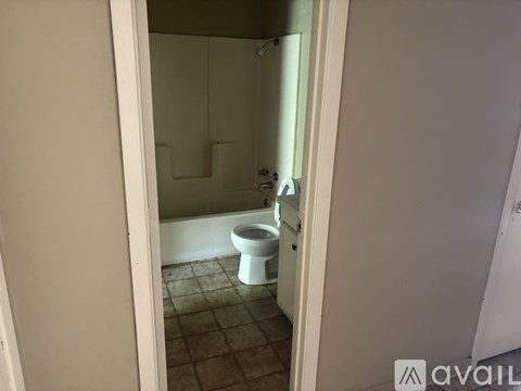 A bathroom with a toilet and a sink.