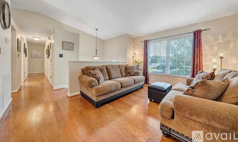 A living room with a couch and a chair.