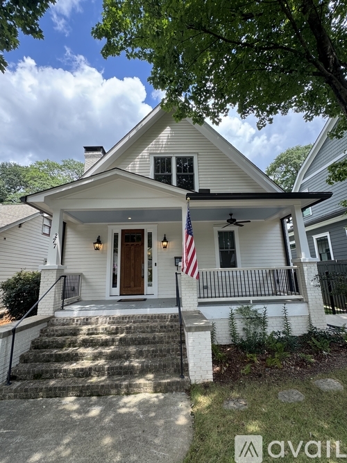 A house with a flag on the front porch.