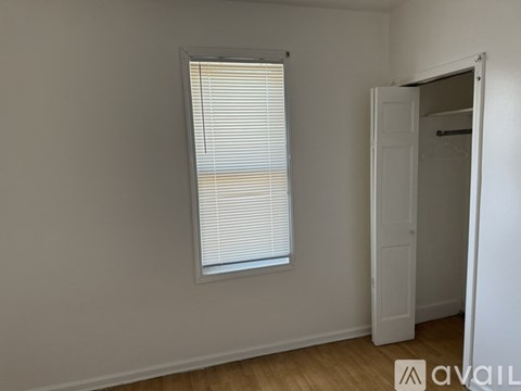 A room with a window and a door.
