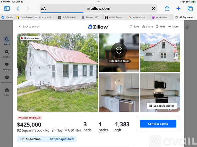 A white house with a red roof is for sale.