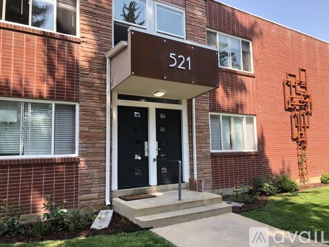 The front door of a building with the number 521 on it.