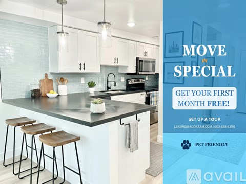 A kitchen with a countertop, bar stools, and a sign offering a free first month.