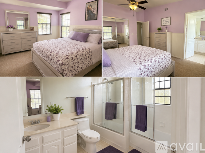A bedroom with a bed, dresser, and mirror.