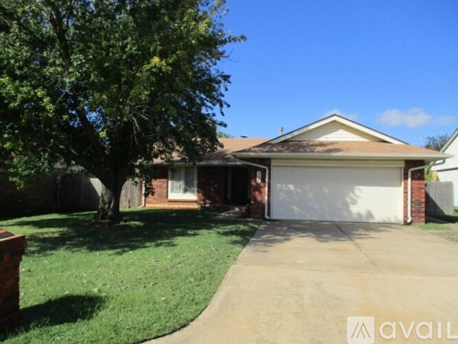 A house with a white garage door is for sale.