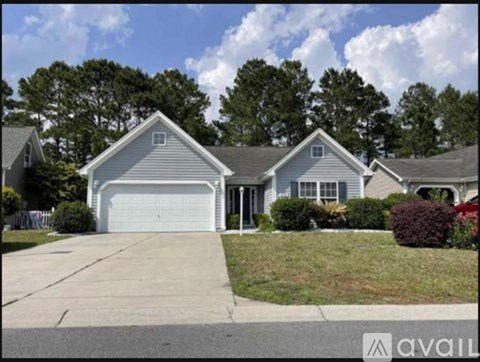 A house with a garage is for sale.