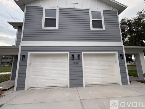 A two-car garage with the number 1702 on it.