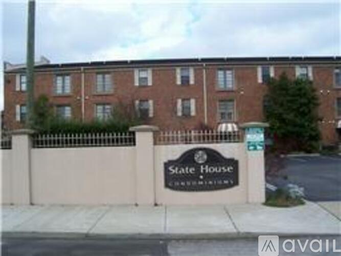 A brick building with a sign that says State House.