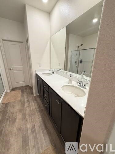 A bathroom with a sink and mirror.