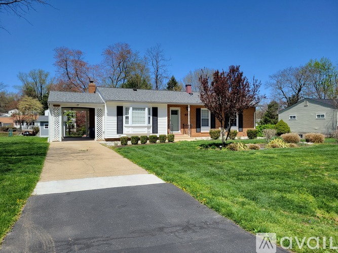 A house with a driveway in front of it.