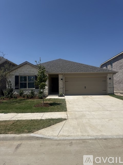 A house with a garage and a driveway.