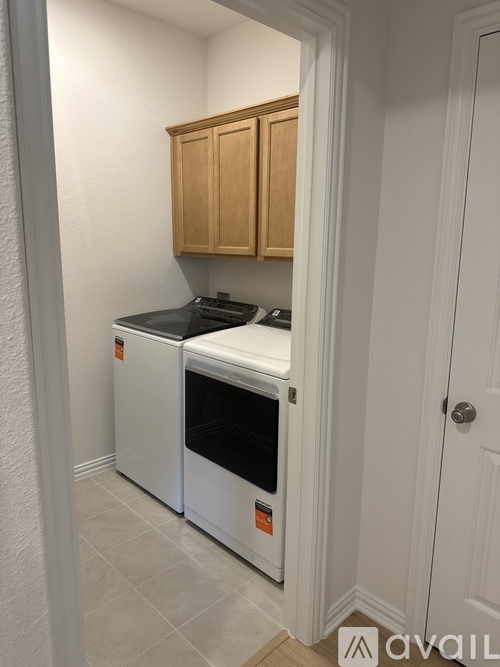A kitchen with a white oven and a white dishwasher.