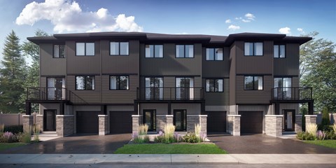 A modern two-story house with a balcony on the second floor.