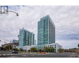 A modern glass building stands tall in the cityscape.