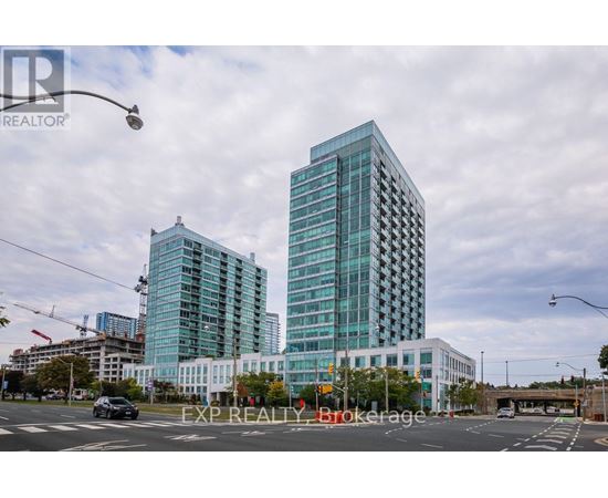 A modern glass building stands tall in the cityscape.