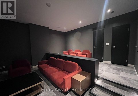 A modern living room with a red couch and a black coffee table.