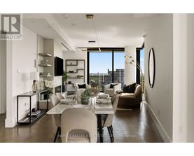 A modern dining room with a table set for two and a view of the city.