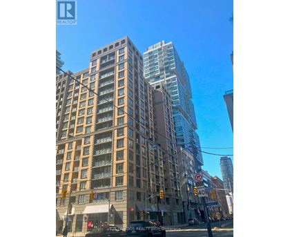A tall building with a no parking sign in front of it.