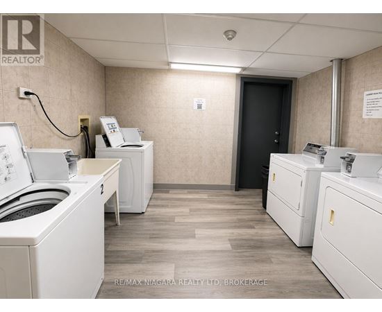 A brokerage office with two desks and a printer.