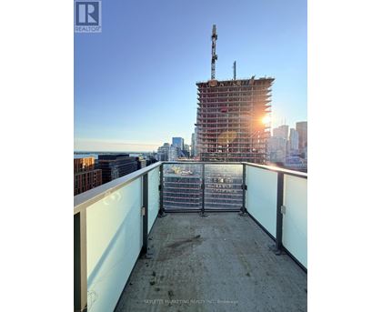 A construction site with a crane and a building under construction.