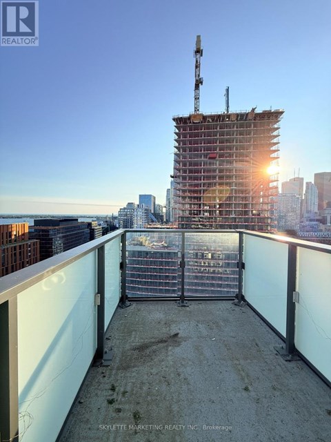 A construction site with a crane and a building under construction.