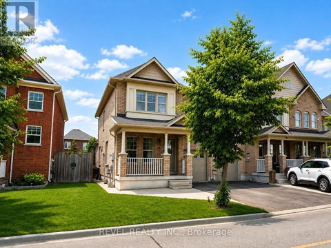 A house with a tree in front of it.