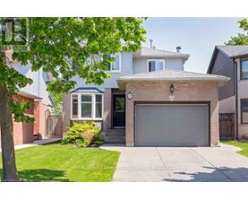 A house with a garage is for sale.