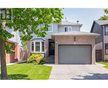 A house with a garage is for sale.