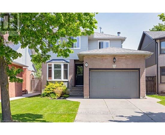 A house with a garage is for sale.