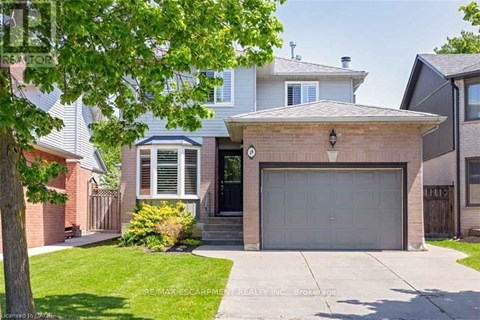 A house with a garage is for sale.