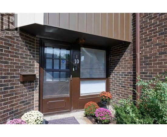 A brown door with a glass window and a number 10 on it.