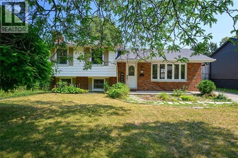 A house with a lawn in front of it.