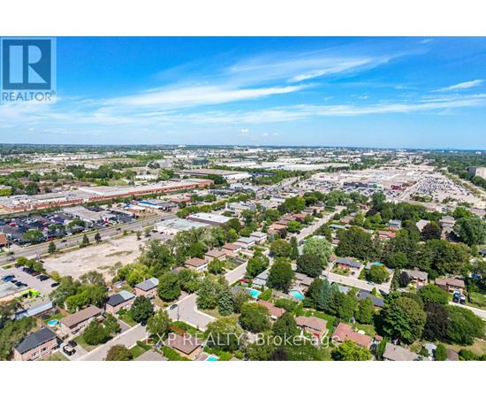 An aerial view of a residential area with a clear blue sky above.