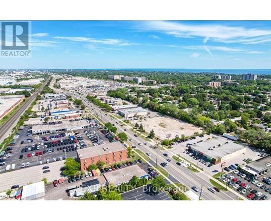 A bird's eye view of a parking lot with a clear blue sky above.