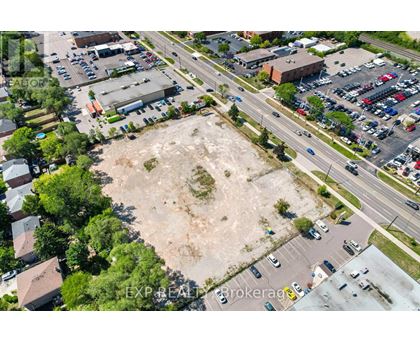 An aerial view of a parking lot with a large empty space in the middle.