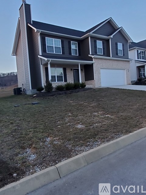 A house with a garage is available for sale.
