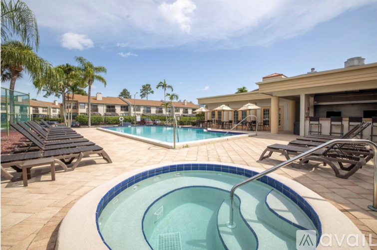 A pool with a blue tiled edge and a white inner lining.