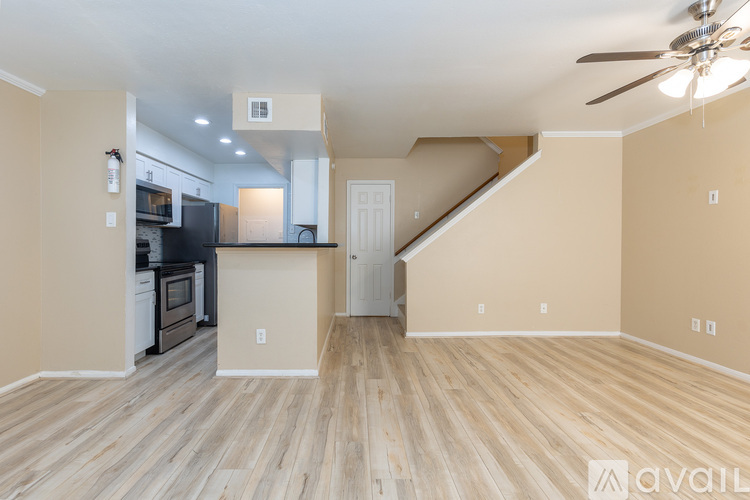 A kitchen with a black stove top oven and a black microwave.